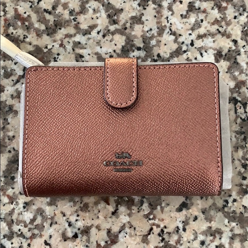 Small metallic pink Coach wallet